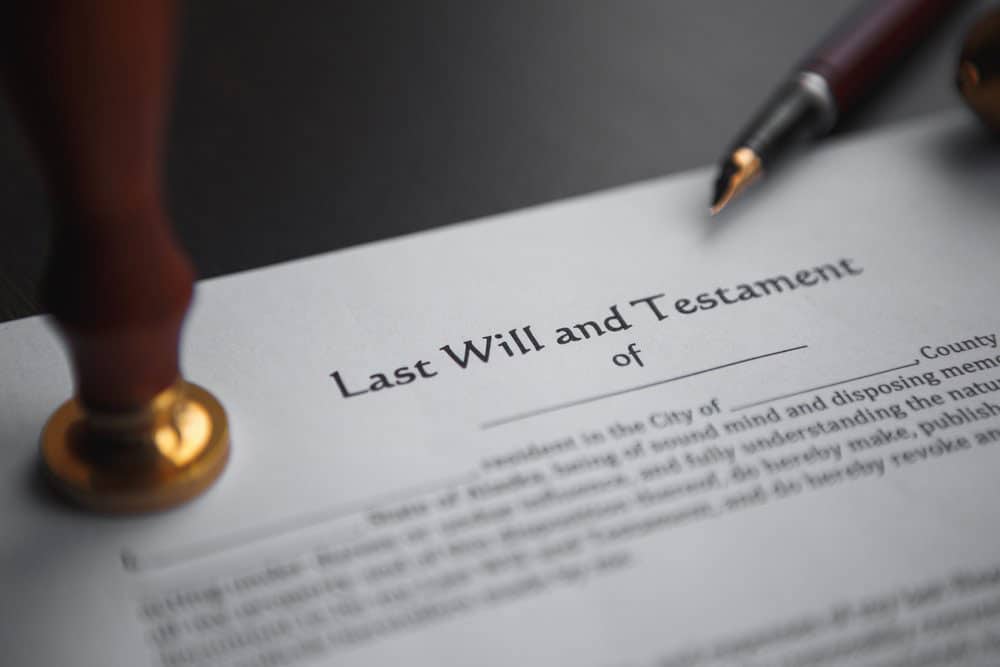 Closeup of last will and testament alongside a pen and gavel.